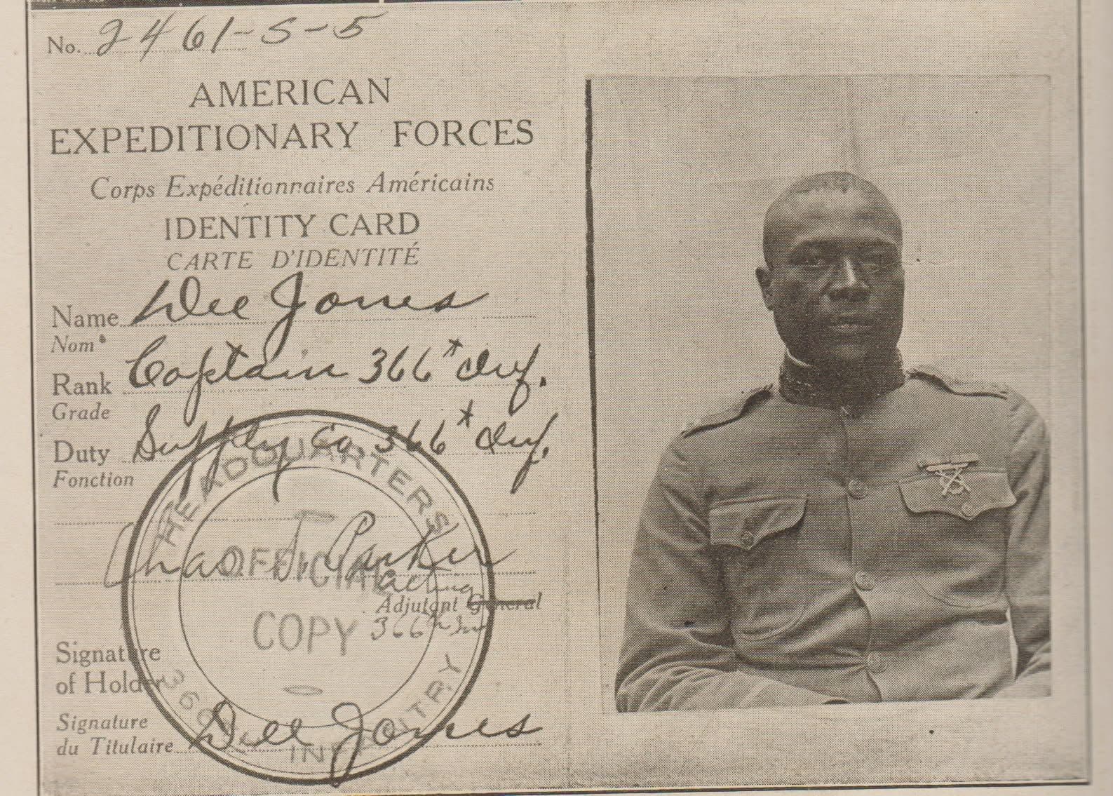 American Expeditionary Forces identity card with a photograph of an officer, printed fields for name, rank, and duty, and a headquarters stamp.