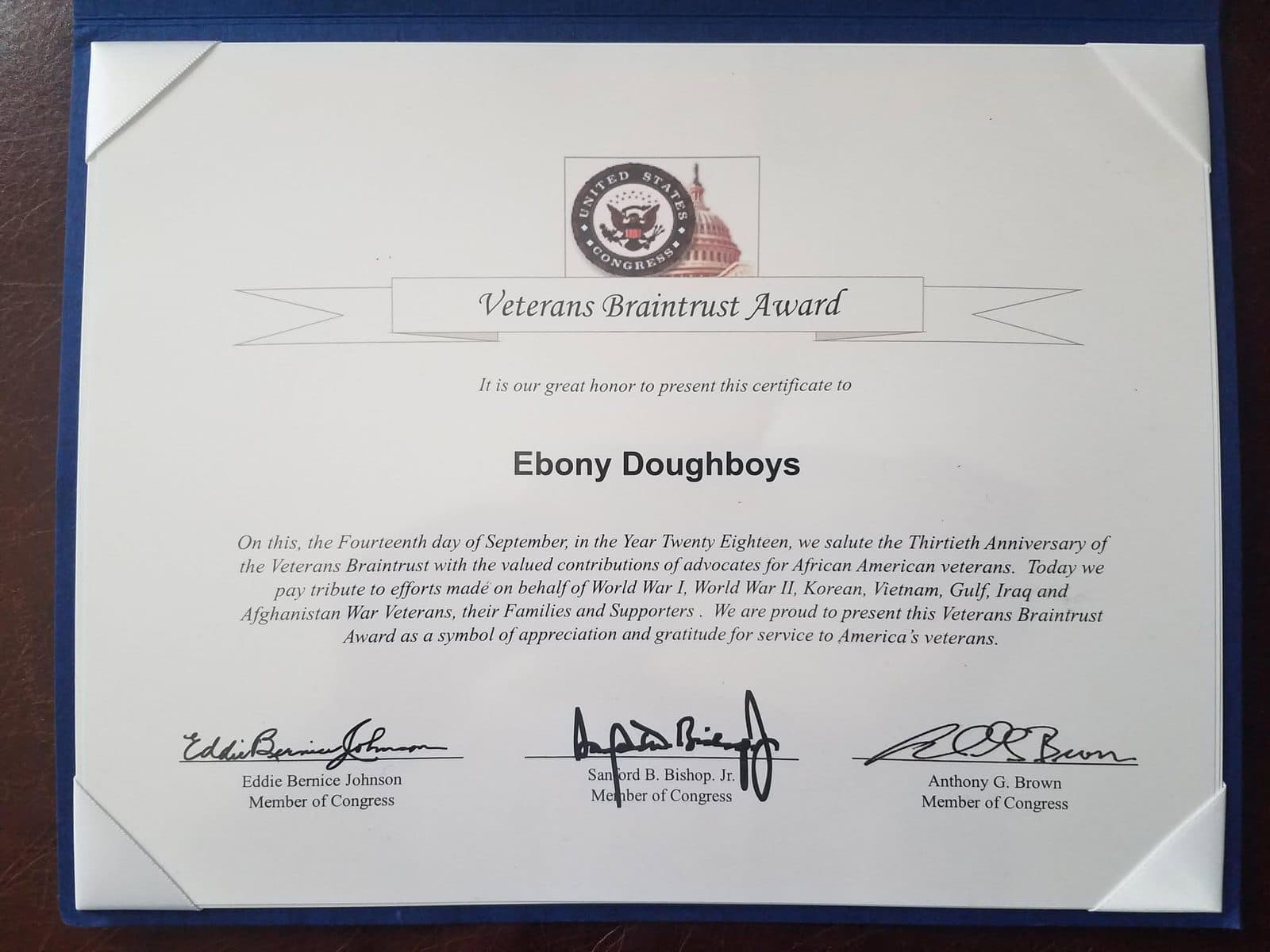 Framed certificate headed "Veterans Braintrust Award" with the Great Seal of the United States Congress at the top and three signatures at the bottom.